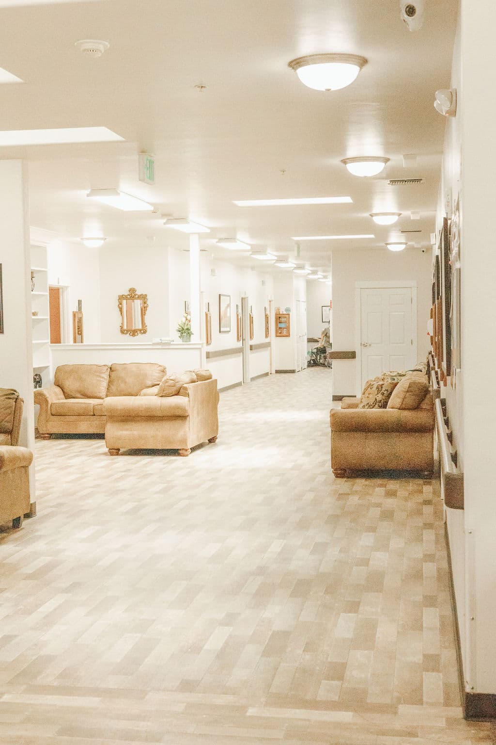 Open lounge at Redwood Park with sofas grouped along a bright corridor